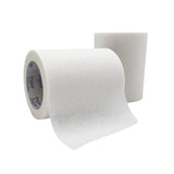 Two rolls of white medical paper tape for wound care or first aid on a white background