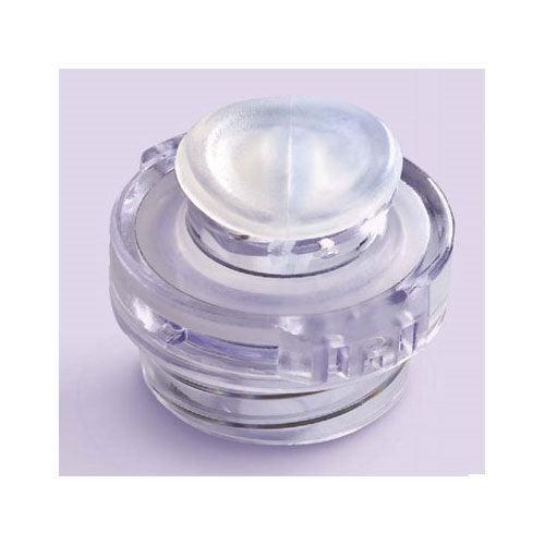 Clear needleless IV connector cap for medical and home care use on light background
