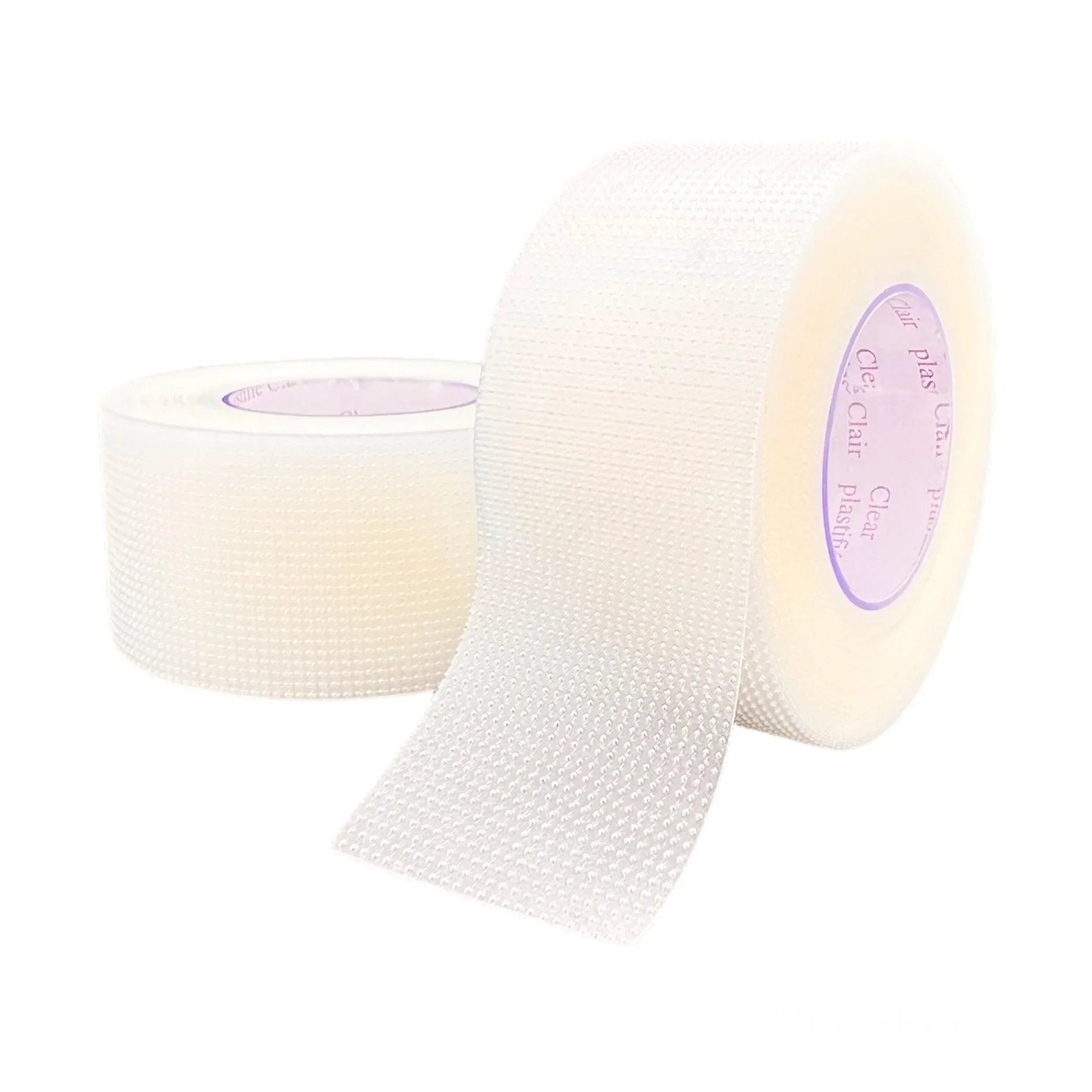 Clear surgical tape roll with textured surface for medical use, unrolled on white background