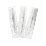 Sterile single-use medical syringes in individual packaging on a white background