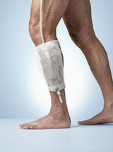 Man wearing a transparent leg urine drainage bag for medical home care use