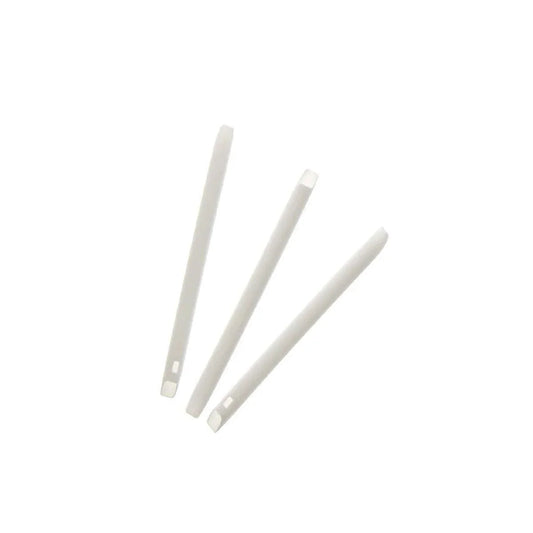 Three white plastic tongue depressors for medical or esthetic use on white background