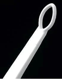 White plastic medical loop tool on black background, home care and esthetic supply