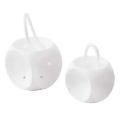 Pair of white plastic nasal inhaler devices with ventilation holes for respiratory therapy