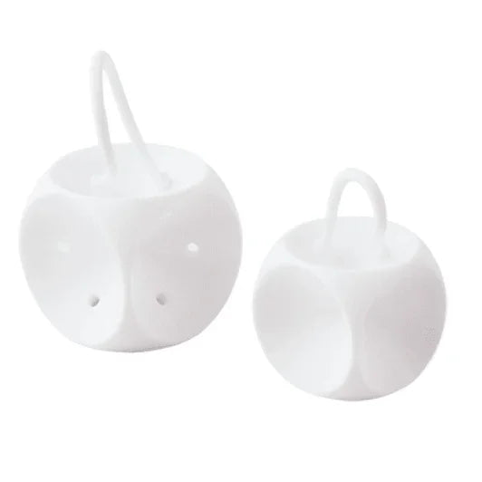 Two white plastic medical supply ball-shaped organizers with handles, side by side