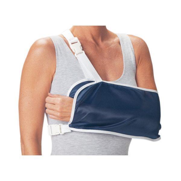 Adult wearing an adjustable navy blue arm sling for injury support