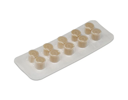 Blister pack of beige medical caps for syringes or IV catheters on white background
