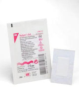 Sterile adhesive medical dressing bandage pad in individual packaging on white background