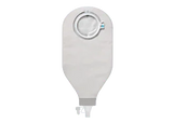 Ostomy drainage bag with adhesive ring for home care and medical use on grey background