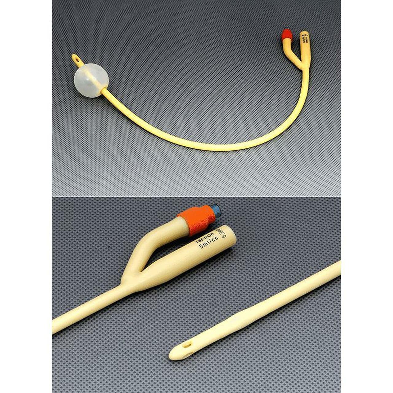 Sterile Foley catheter with balloon, medical urinary drainage tube on gray background