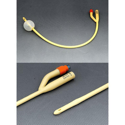 Foley catheter with balloon, two-way latex urinary catheter on grey background