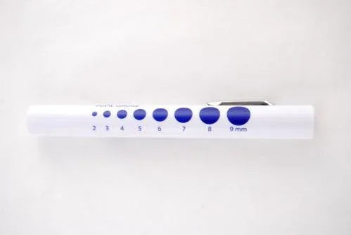 White medical pupil gauge pen with blue measurement circles, tool for eye exams or assessments