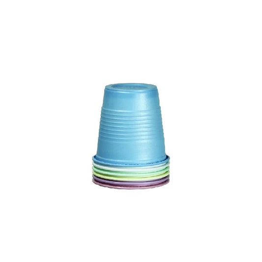 Stack of colorful plastic medicine cups on white background, ideal for home care and medical use