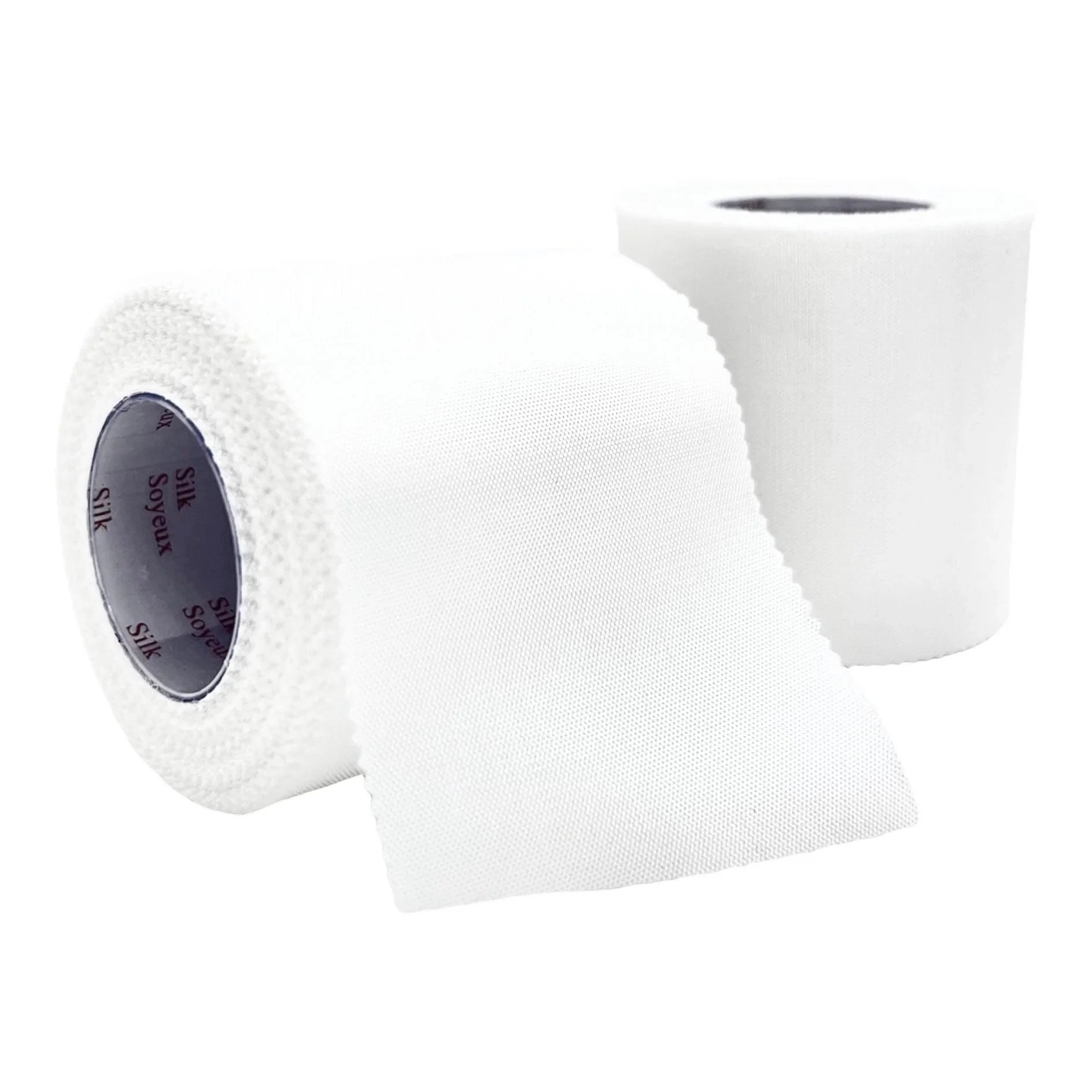 Two rolls of white medical silk tape, one partially unrolled, on a white background