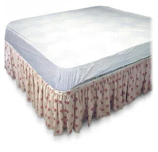 Waterproof mattress protector on bed with floral bed skirt, home care bedding supply