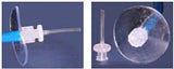 Medical oxygen tubing connector with clear plastic disc on blue background