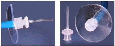 Medical oxygen tubing connector with clear plastic disc on blue background
