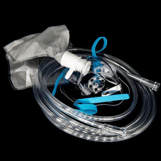 Oxygen mask with tubing and reservoir bag for respiratory therapy on black background