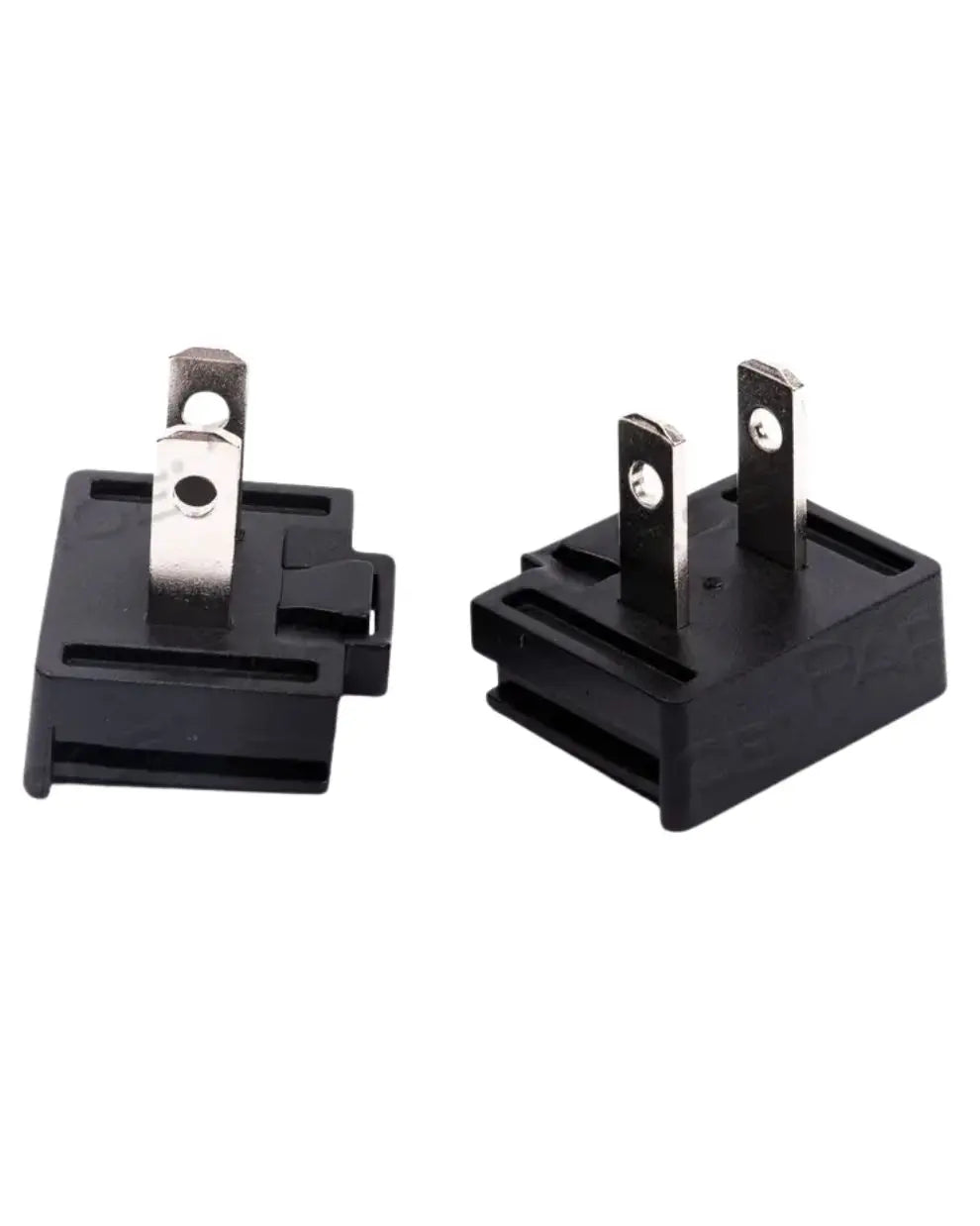 Black two-prong electrical plug adapters for medical equipment on white background