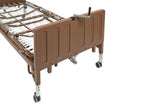 Electric low height hospital bed with metal frame and adjustable height on caster wheels