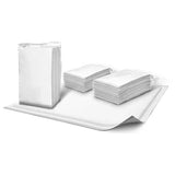 Disposable medical underpads stacked on a white surface for home care and hygiene
