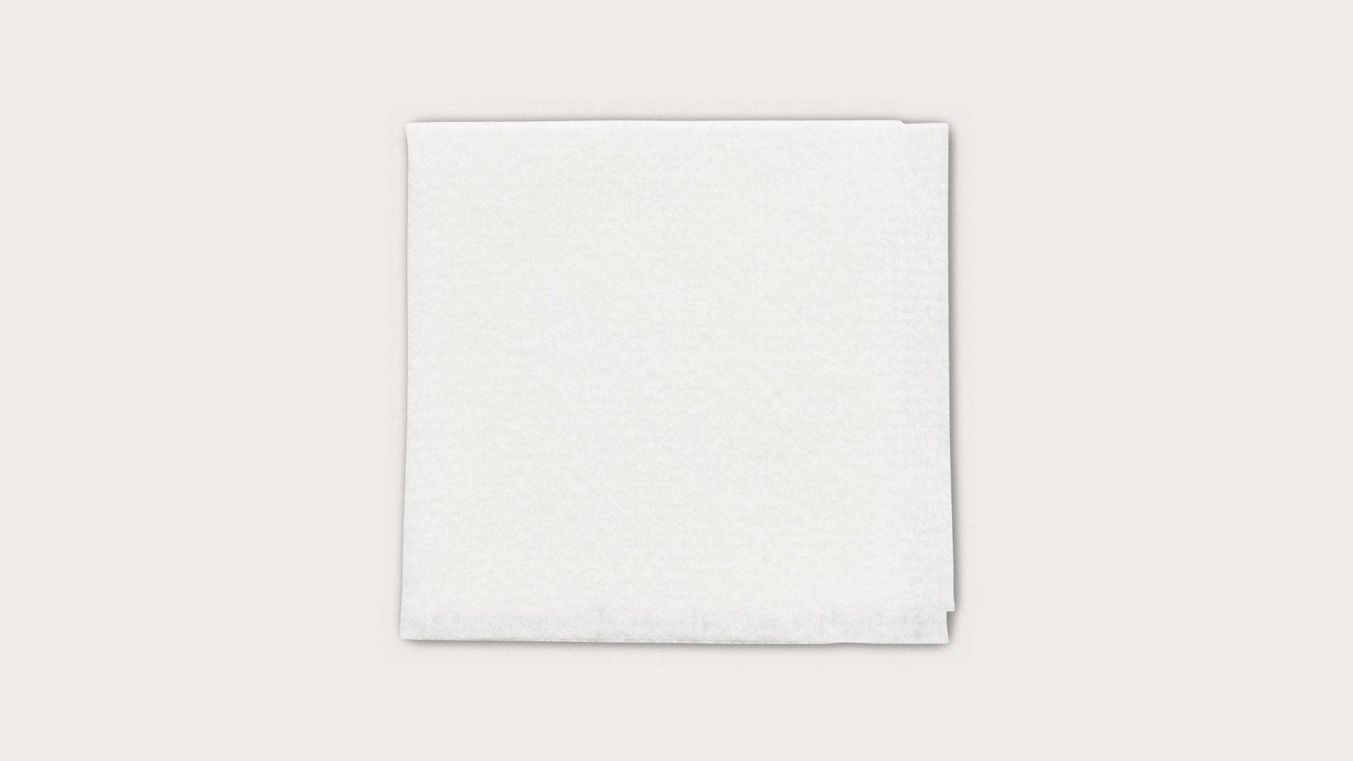 Sterile white medical gauze pad on a plain background for wound care