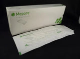 Mepore sterile adhesive wound dressings box and individually wrapped dressing on black background