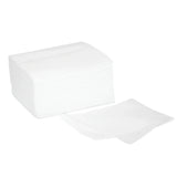 Stack of white non-woven medical gauze pads for wound care and first aid