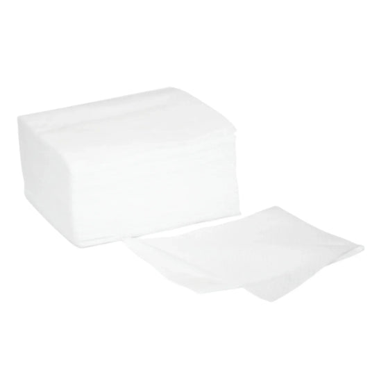 Stack of white non-woven gauze pads for medical or esthetic care on white background.