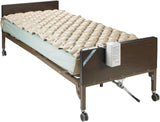 Hospital bed with beige air alternating pressure mattress for home care or long-term care