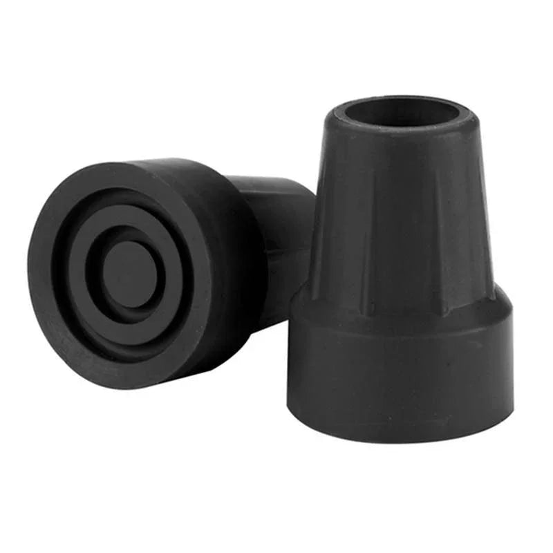 Black rubber cane tips on white background, mobility aid accessories.