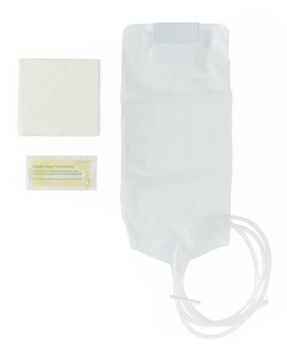 Disposable enema kit with plastic bag, tubing, cleansing pad, and Castile soap packet