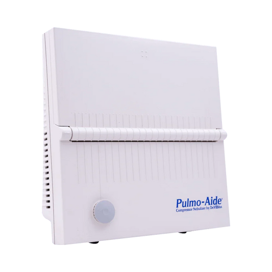 Pulmo-Aide compressor nebulizer medical device with white plastic case on blue background