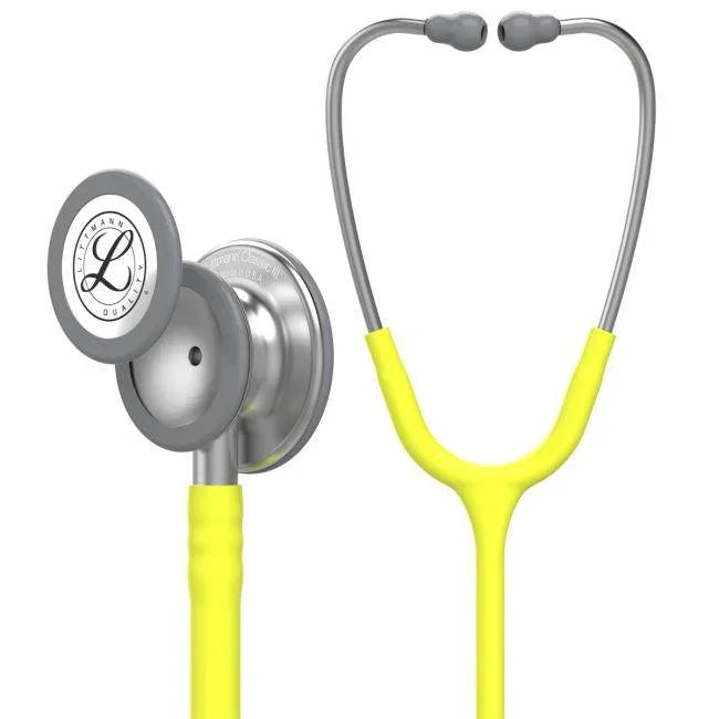 Yellow medical stethoscope with stainless steel chestpiece on white background.