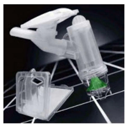 Transparent plastic nebulizer kit with green valve on a dark grid background, respiratory supply