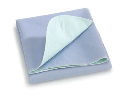 Folded blue reusable bed pad with quilted absorbent layer for incontinence protection