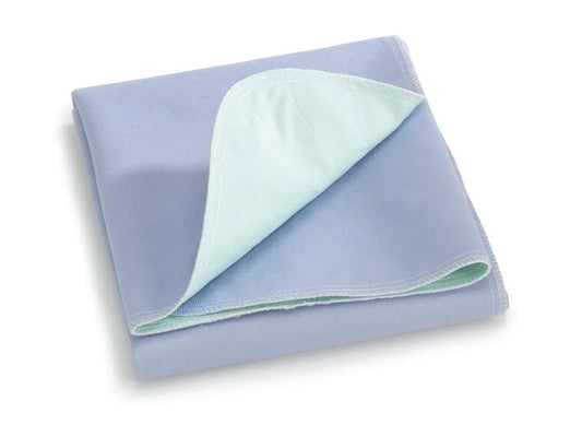 Folded blue reusable bed pad with quilted absorbent layer for incontinence protection