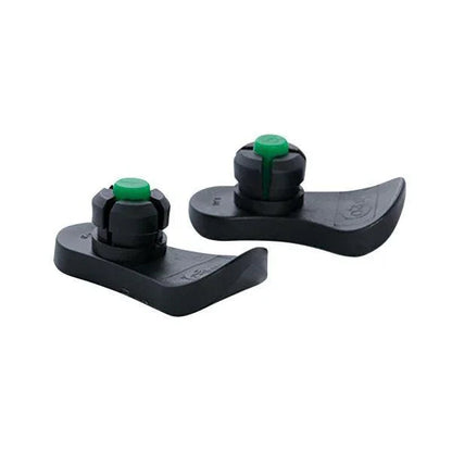 Pair of black walker glides with green tips for mobility aid stability on smooth floors