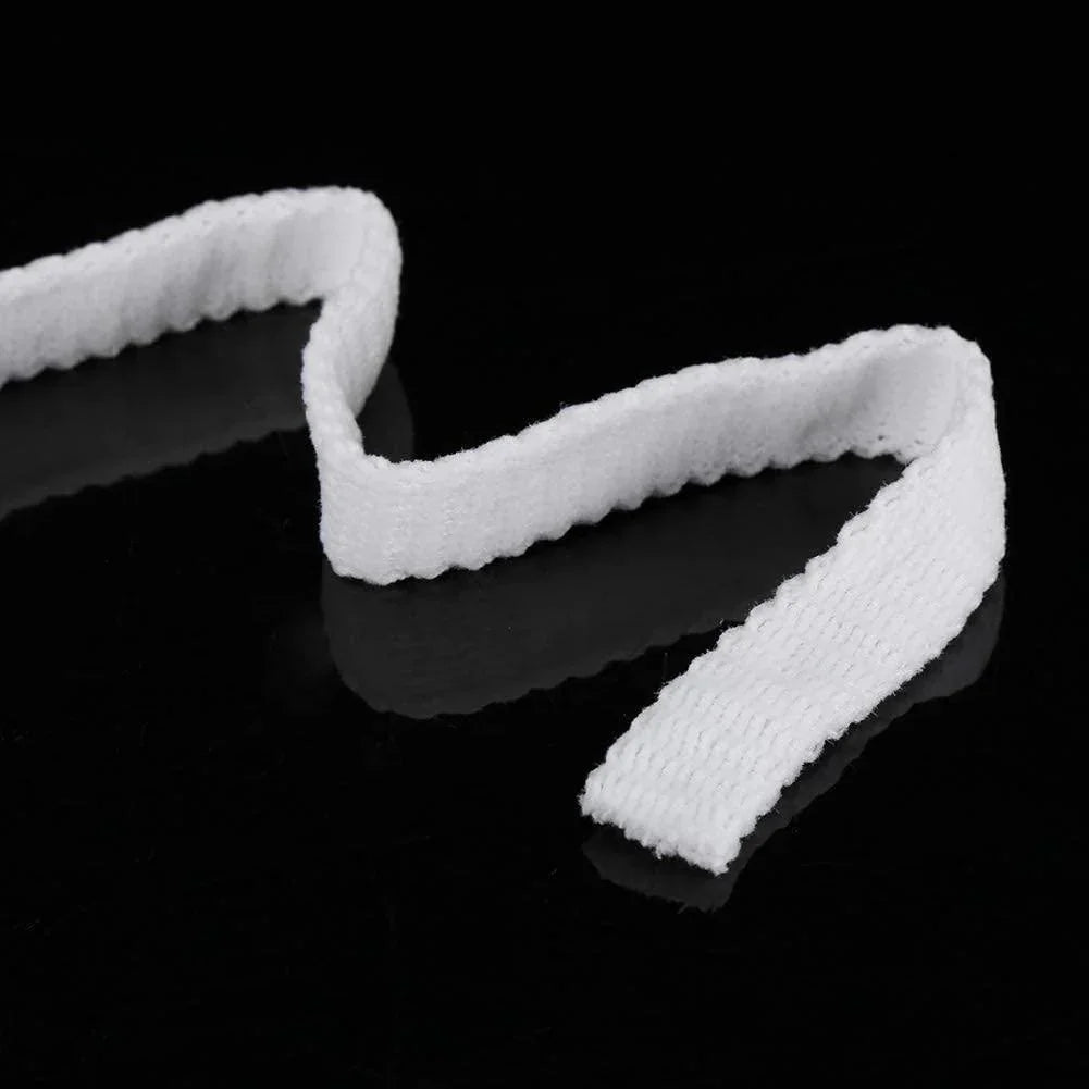 White tubular mesh bandage strip on black background, medical wound dressing supply