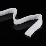 White tubular mesh bandage strip on black background, medical wound dressing supply