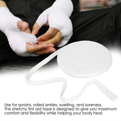 Tubular mesh bandage roll with hands wrapped in white medical bandages, first aid supply